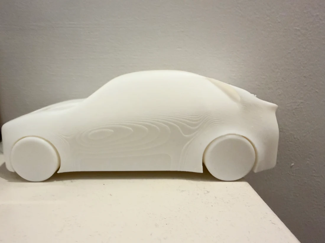 Side view of the white PLA SUV prototype